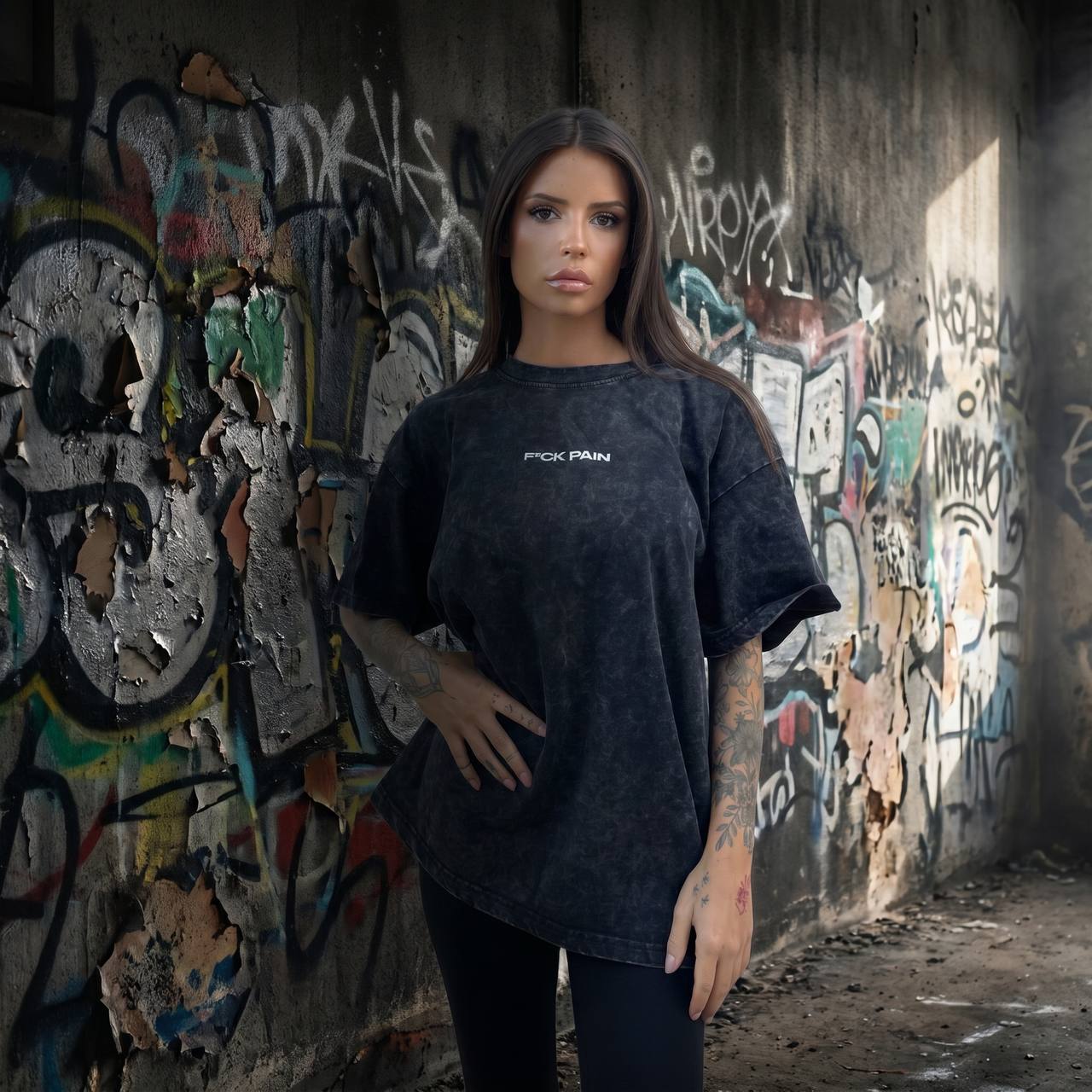 F*CK PAIN Acid Wash Oversized Tee — female lifestyle front shot tattooed model