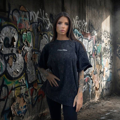 F*CK PAIN Acid Wash Oversized Tee — female lifestyle front shot tattooed model